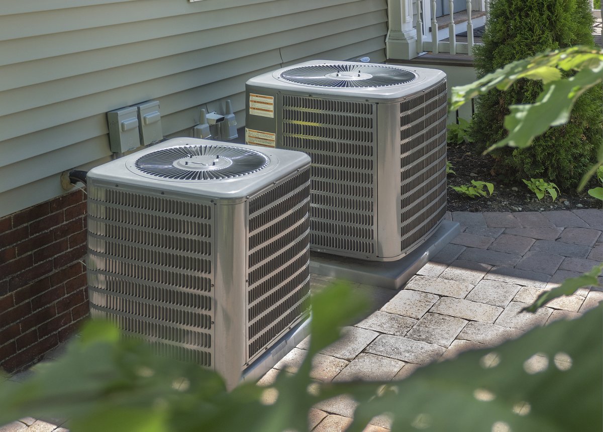 HVAC technician diagnosing a central air conditioner that is running but not cooling a Binghamton NY home